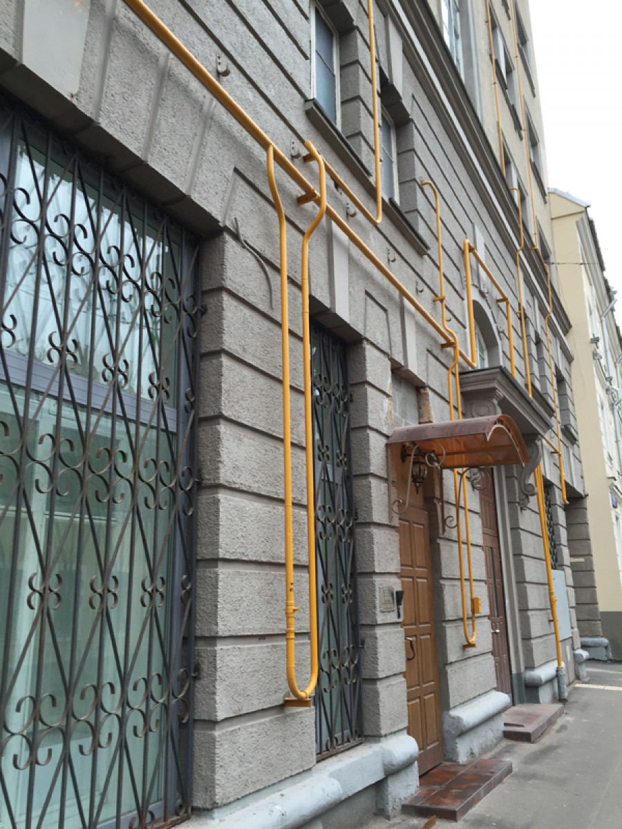 Yellow gastubes attached to the facade